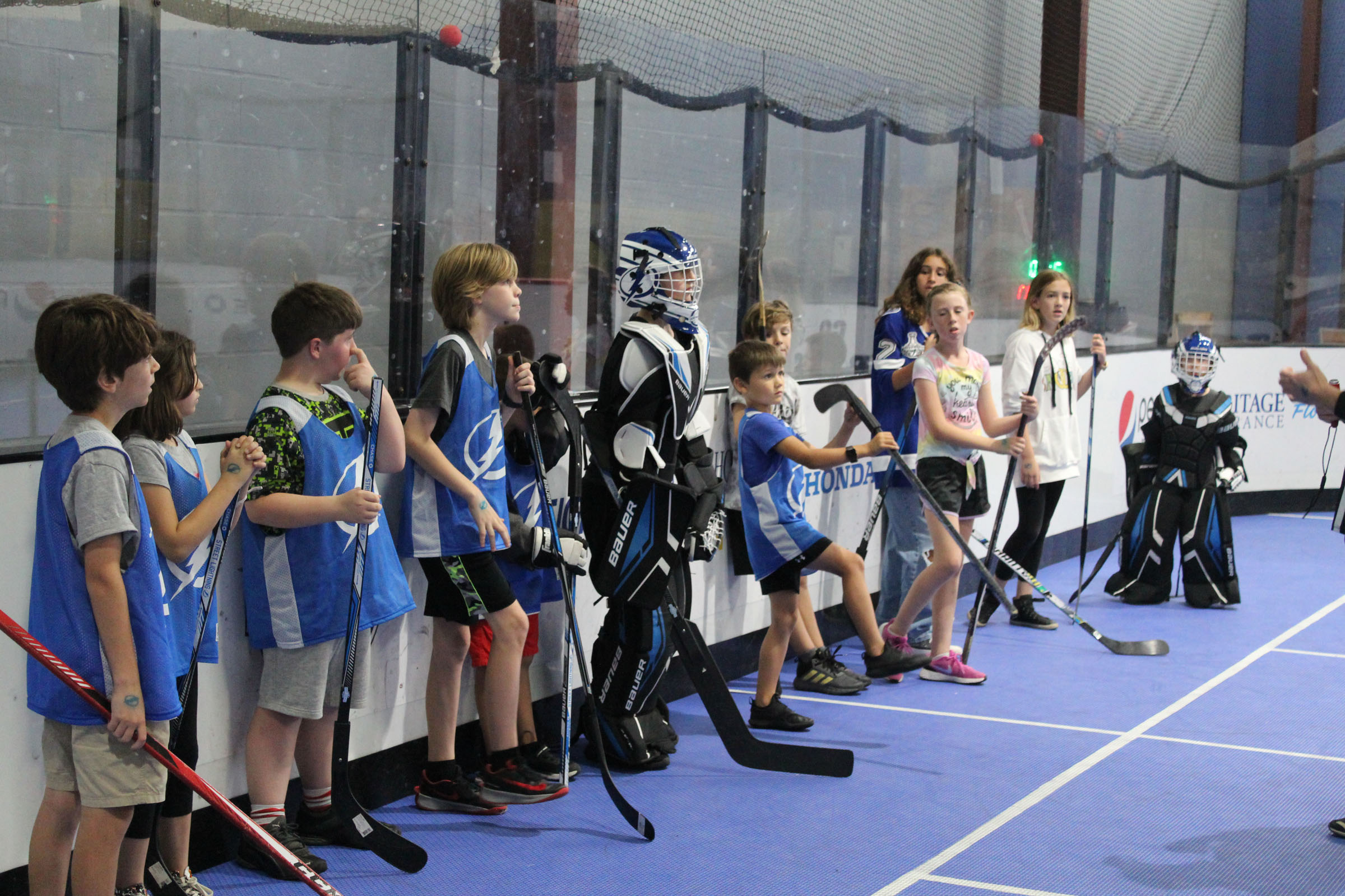 Roller hockey enthusiasts burn up the asphalt at weekly games