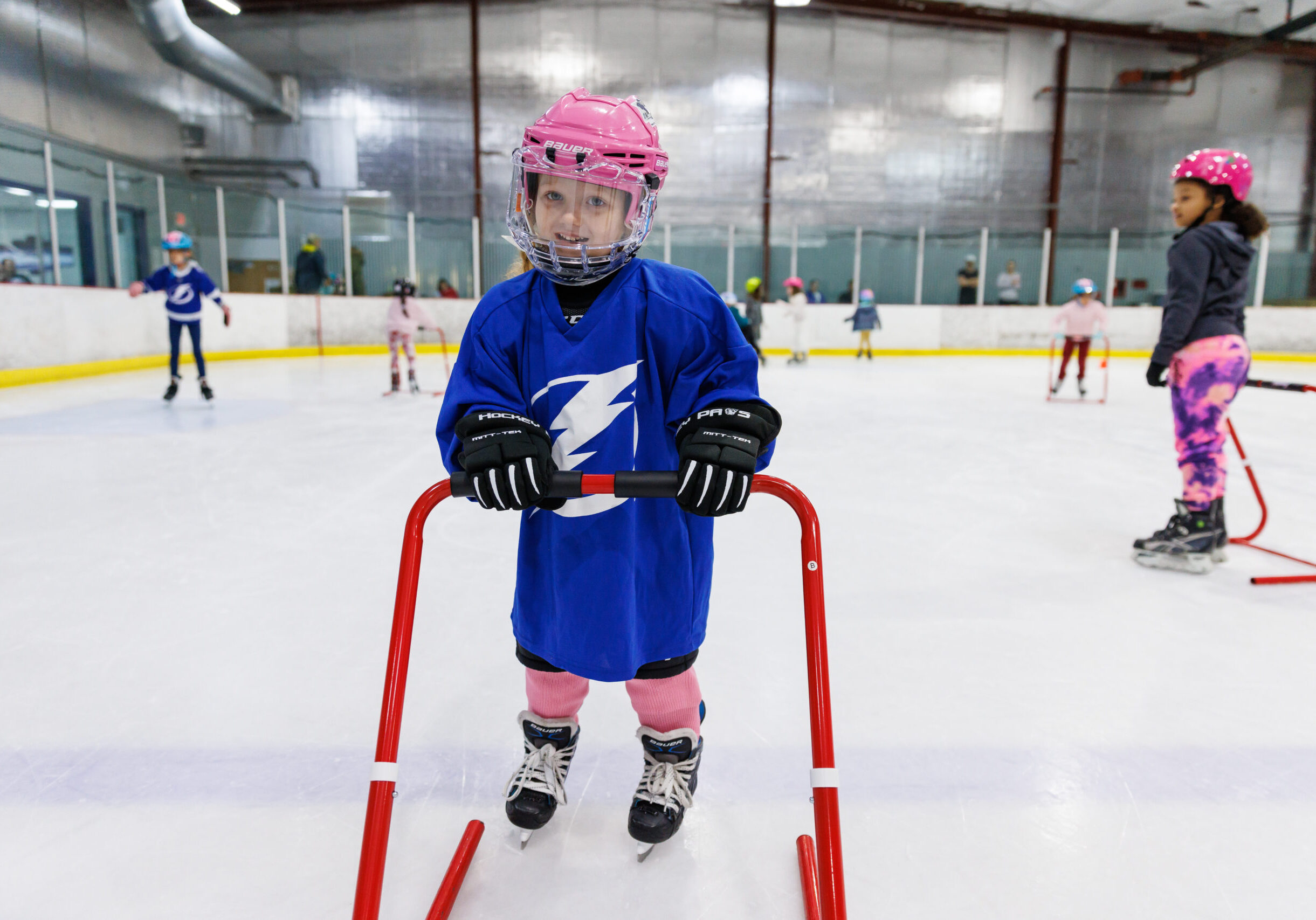 TAMPA, FL - JANUARY 29: Kids ages 5-10 participate in the Tampa Bay Lightning Learn to Skate hockey program at Xtra Ice Power Pole on Sunday, January 29, 2023 in Tampa, Florida. The Tampa Bay Lightning are committed to providing girls within Florida and the Tampa Bay Area a safe, competitive environment to grow their individual hockey skills while promoting the enjoyment, appreciation and understanding of hockey. 
(Photo by Casey Brooke Lawson/Tampa Bay Lightning)